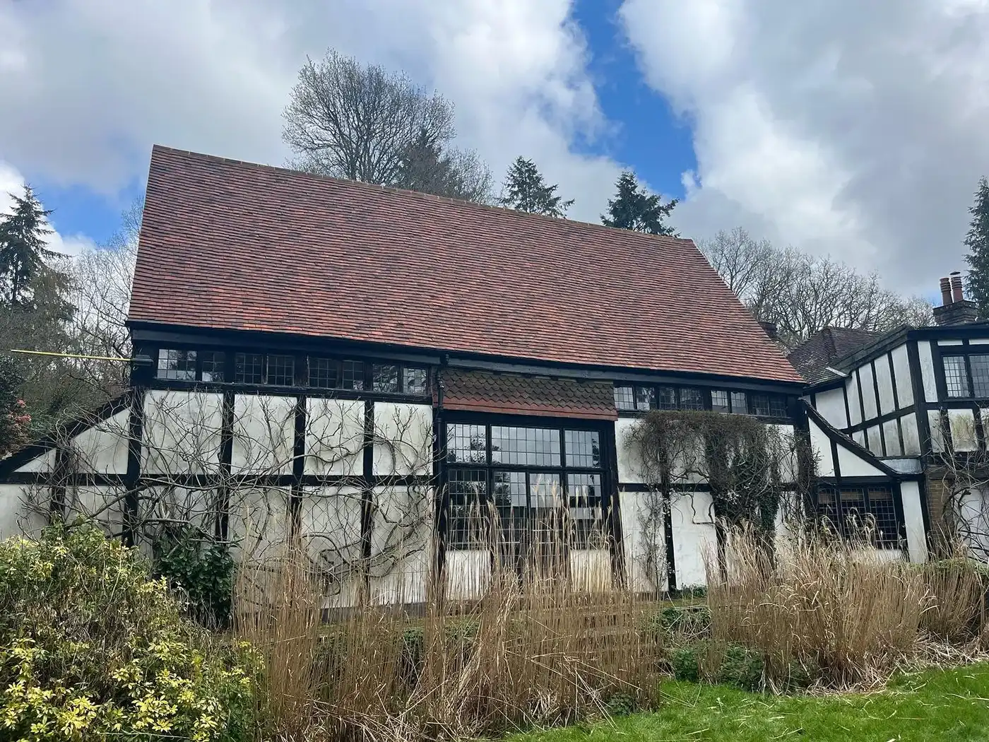 a house with a red roof and a brown roof